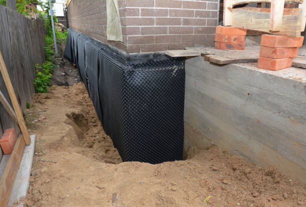 Happy homeowners after waterproofing job in Houston